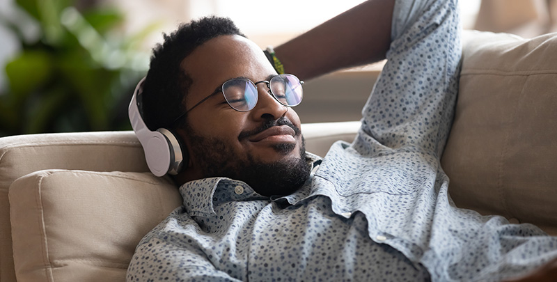 Man experiencing the high efficiency of ductless heating and cooling in Des Moines, Iowa
