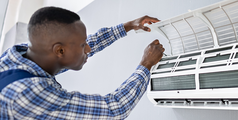 Man working on a ductless system 