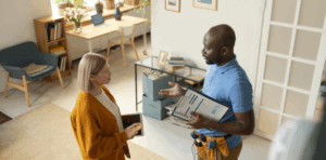 An HVAC inspector explaining their findings to a homeowner